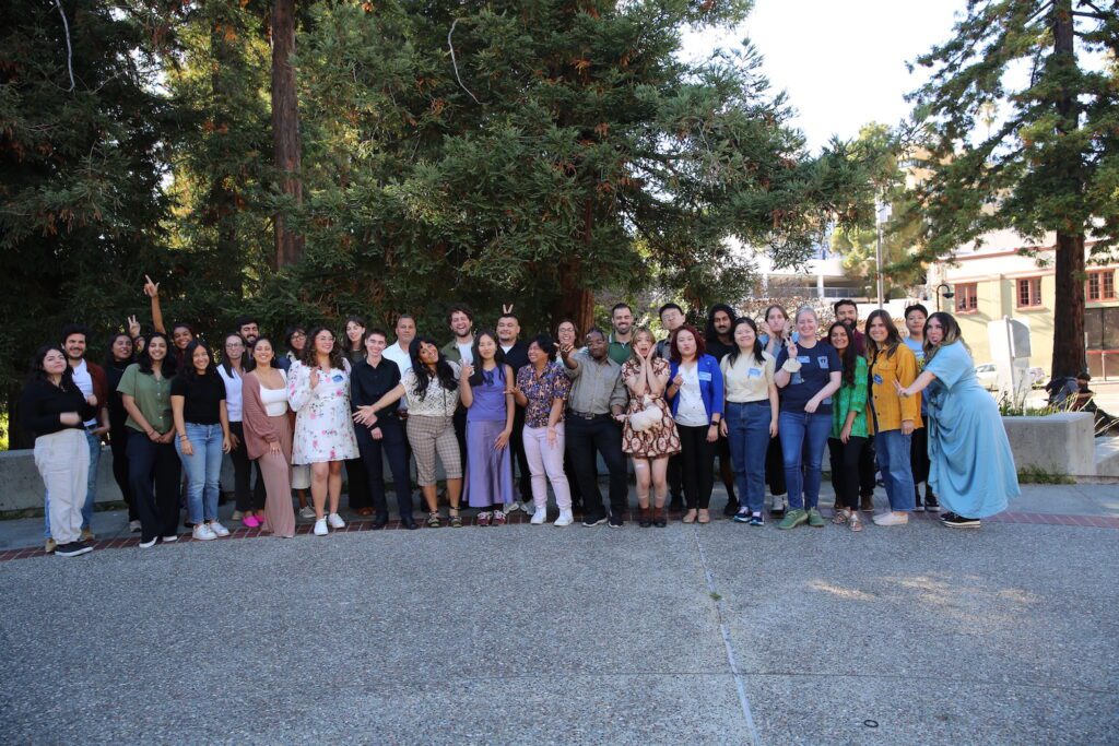 Funny group photo of 2024 Fellows. outside